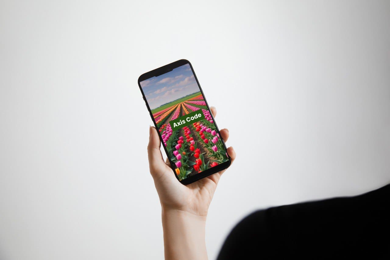 Hand holding a smartphone displaying C++ course 'Axis Code'