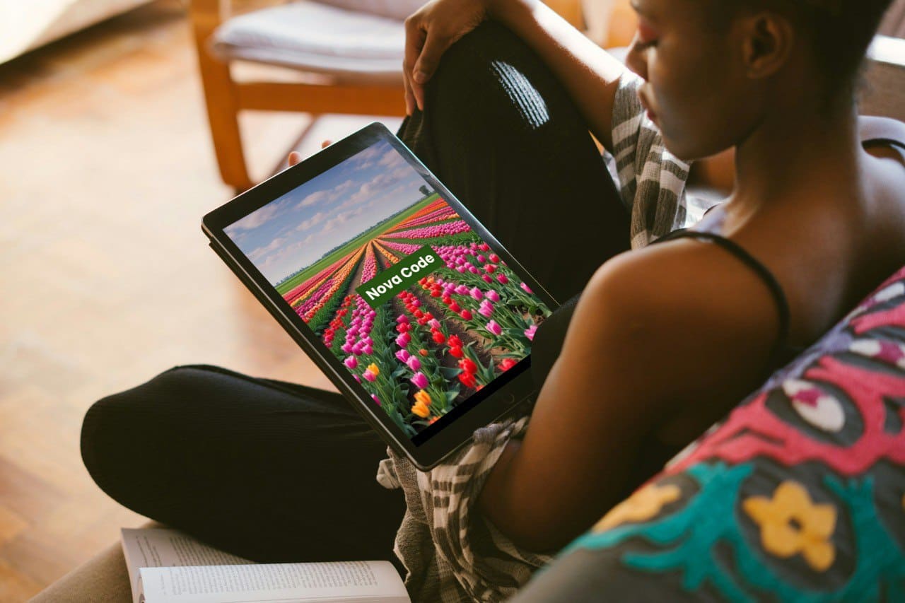 Person holding a tablet with a colorful screen displaying a C++ course 'Nova Code.